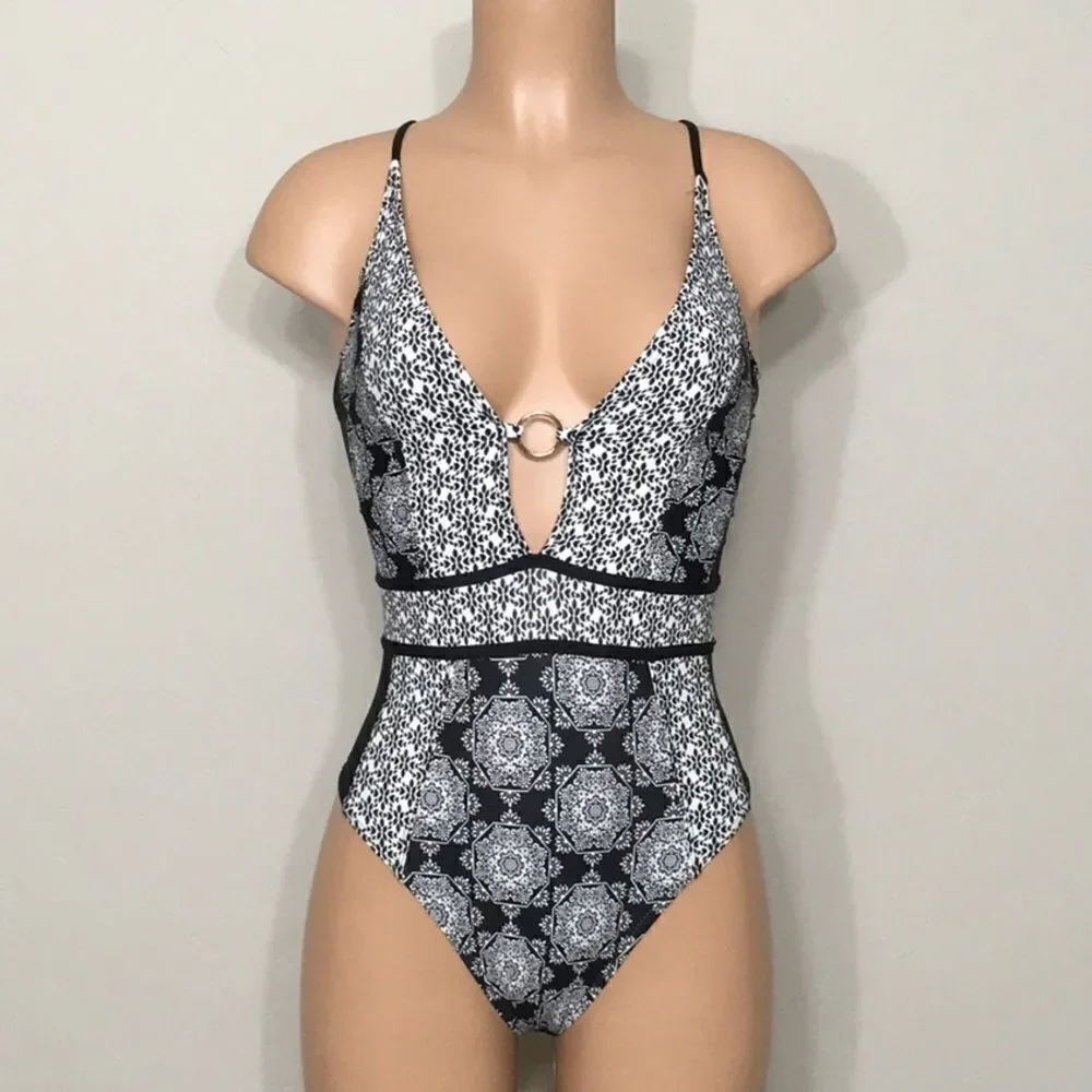 Medallion print plunge swimsuit. RUNS SMALL. NWOT